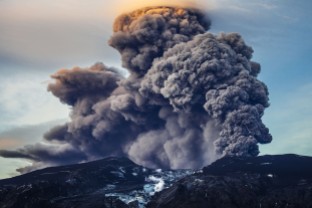 A volcano erupts in Iceland, spewing Greenhouse Gases into the atmosphere.